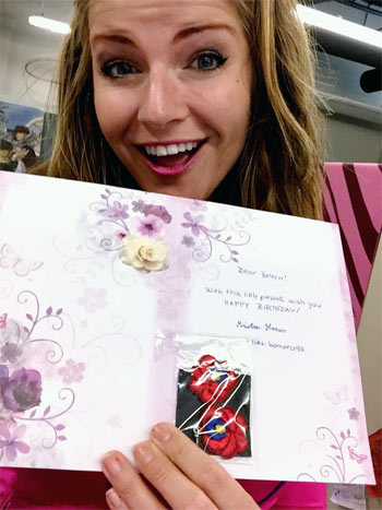 beleen opens card and finds birthday present earrings